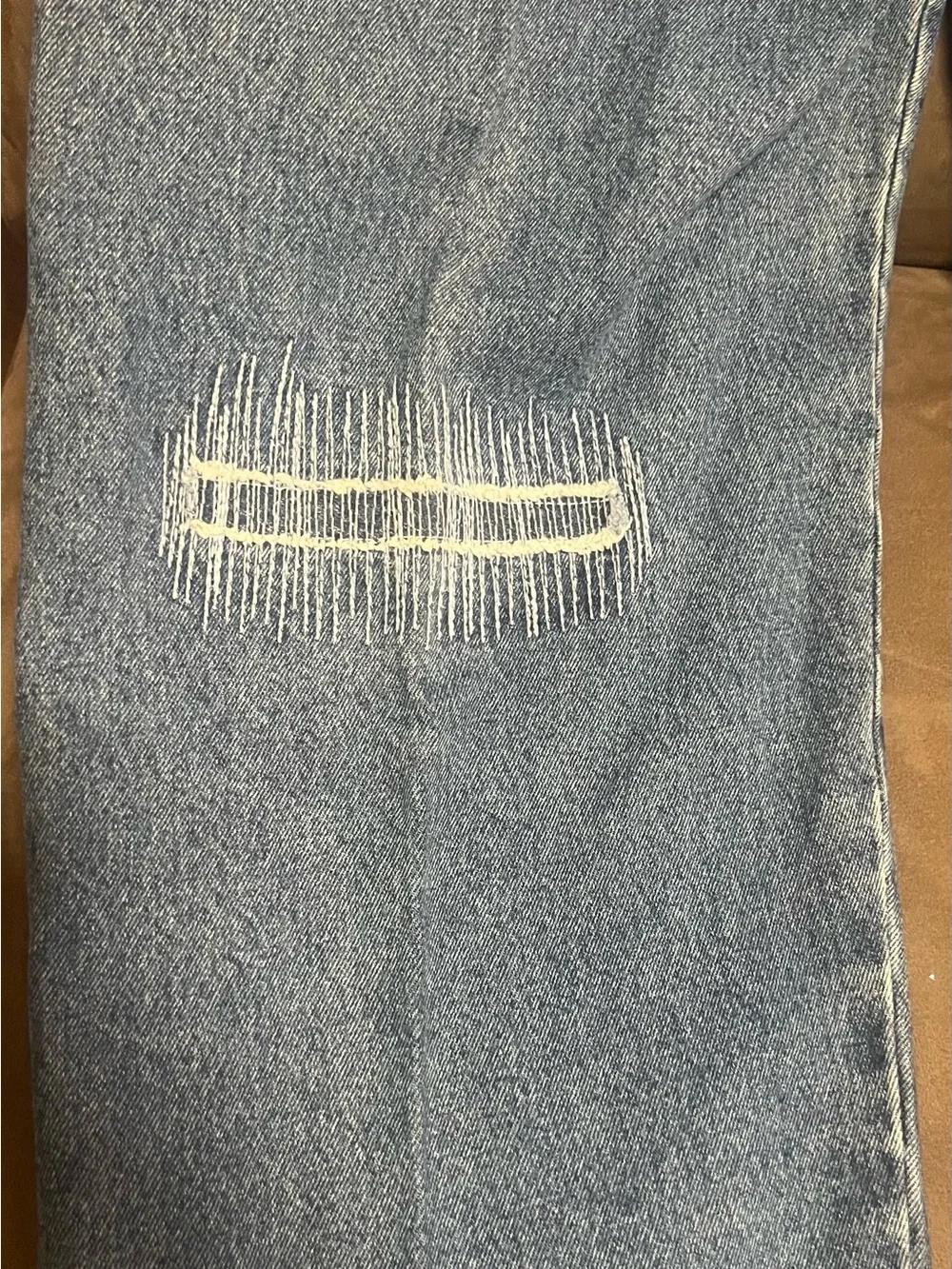 Men's Distressed Blue Jeans with Patch Detail